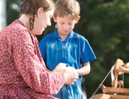 Woman and a boy doing handmade craft